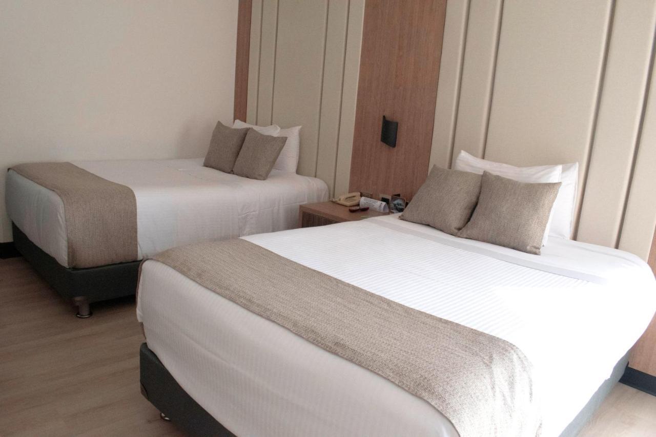 Hotel Dann Carlton Belfort Medellín Eksteriør bilde A room at the hotel